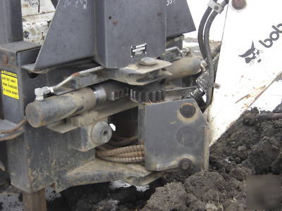 Bobcat 742 b with backhoe and auger