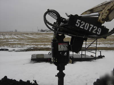 Bobcat 742 b with backhoe and auger