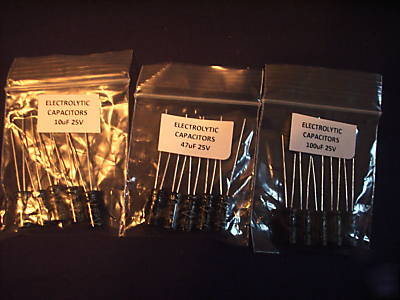 Assorted resistors, heat shrink, leds, pcb in a box