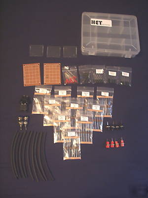 Assorted resistors, heat shrink, leds, pcb in a box