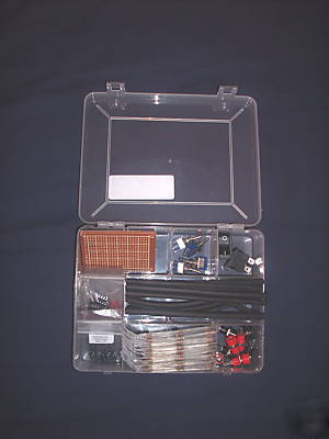 Assorted resistors, heat shrink, leds, pcb in a box