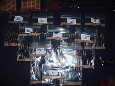 Assorted resistors, heat shrink, leds, pcb in a box