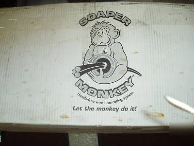 Soaper monkey hands free wire lubricating system. 