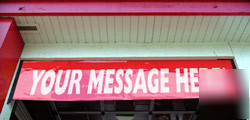 Garage bay door banner / sign attachment system
