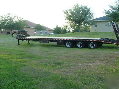 Gooseneck trailer three, triple, axle flatbed 30K 38'