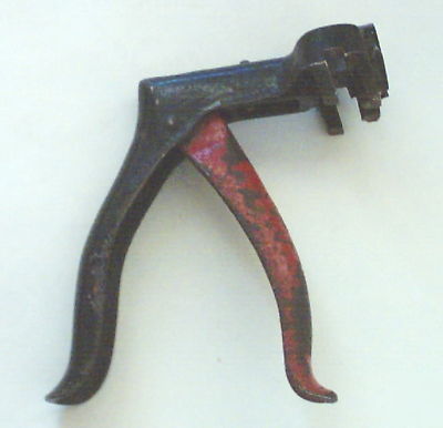 Vintage hand held metal rectangular punch leather ear