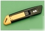 Heavy duty spring loaded safety knife - left hand
