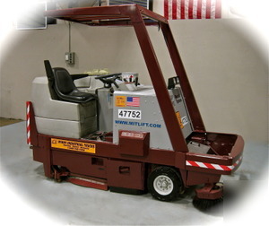 A powerboss CSS82 combo sweeper scrubber tennant