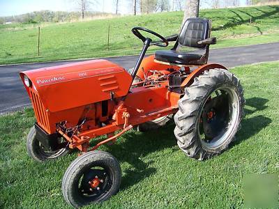 Powerking 2414 tractor with finish mower and implements