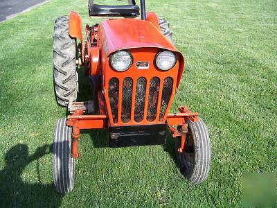Powerking 2414 tractor with finish mower and implements
