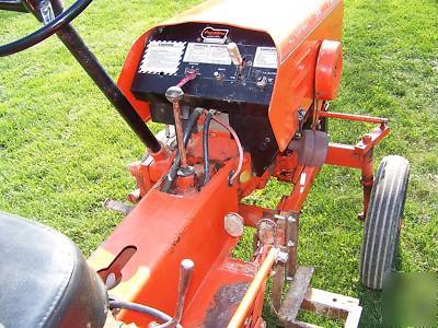 Powerking 2414 tractor with finish mower and implements