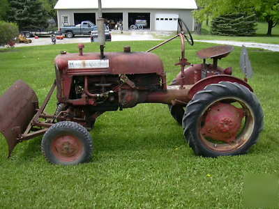 Farmall cub tractor and snow blade