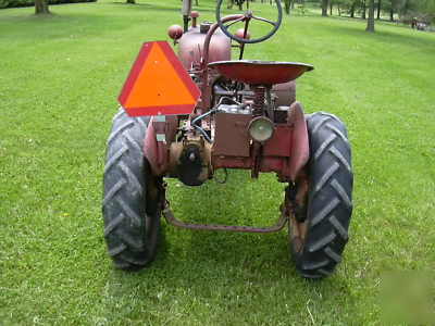 Farmall cub tractor and snow blade