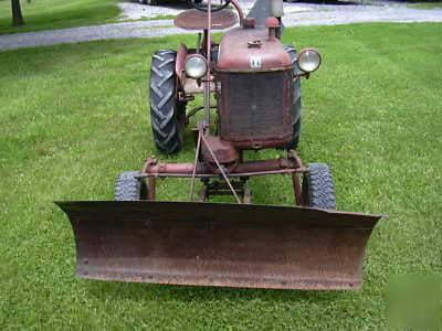 Farmall cub tractor and snow blade