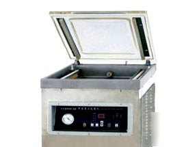 Vertical vacuum chamber packer and sealing machine 