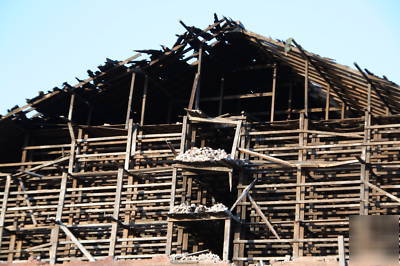 Lumber, large timber, wood beams, dismantling bulding