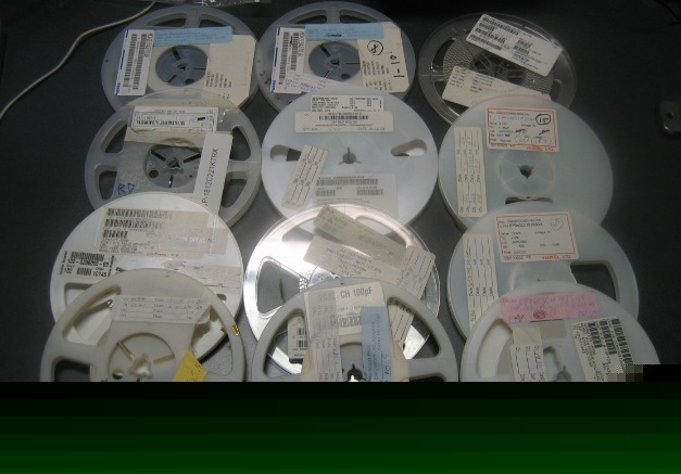 Lot of 12 reels of mixed quantity capacitors
