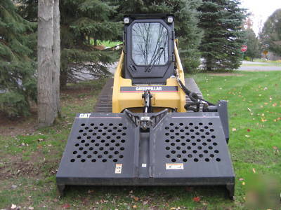Skidsteer - cat landscape rake - harley rake-rockhound
